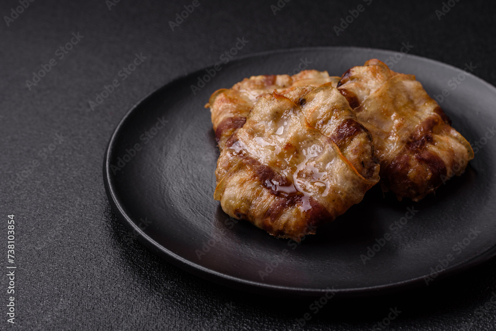 Round minced chicken or pork cutlet wrapped in bacon with salt, spices and herbs Round minced chicken or pork cutlet wrapped in bacon with salt, spices and herbs