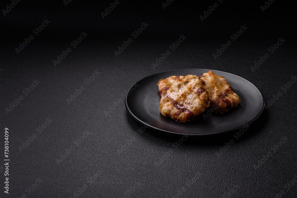 Round minced chicken or pork cutlet wrapped in bacon with salt, spices and herbs Round minced chicken or pork cutlet wrapped in bacon with salt, spices and herbs