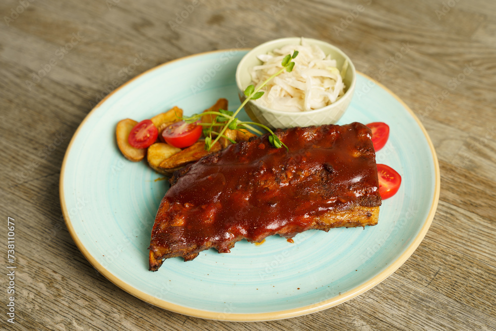 BBQ pork ribs with steak potatoes and cabbage salad BBQ pork ribs with steak potatoes and cabbage salad
