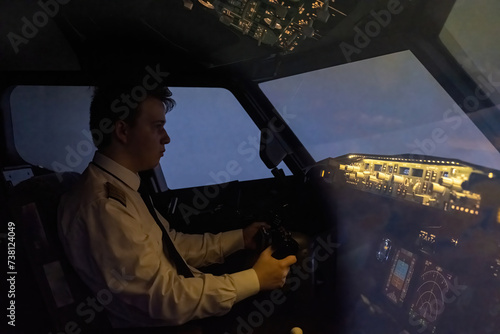 Fotografie Aspiring captain skillfully directs plane during night