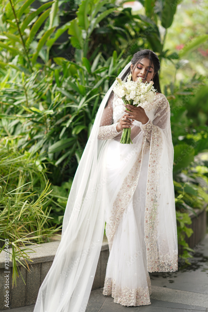 south Asian, wedding photography, woman, Christian wedding, outdoor, beautiful natural background ,multiple different poses with a wedding bouquet flower