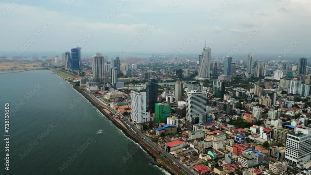Aerial view over Colombo city skyline, high-rise buildings, urban architecture alongside coast. Dynamic metropolis, real estate development Sri Lanka. Tourists, businesses seek travel South Asia. Aerial view over Colombo city skyline, high-rise buildings, urban architecture alongside coast. Dynamic metropolis, real estate development Sri Lanka. Tourists, businesses seek travel South Asia.