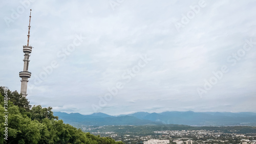 Panoramic View of a Cityscape with a Majestic Tower Standing Proudly on a Hilltop