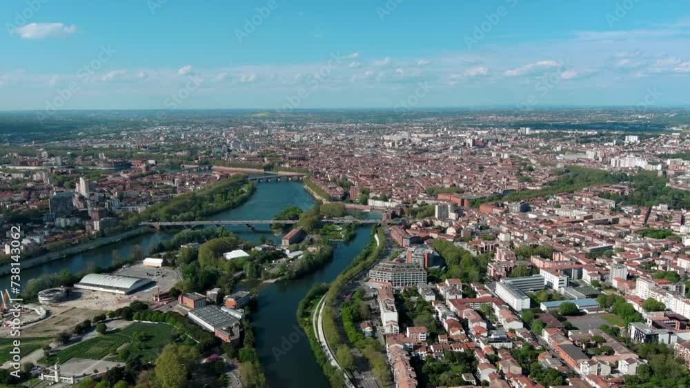 Toulouse aerial panoramic view. It's the capital of Haute Garonne department and Occitanie region in France. Terra-cotta bricks used in many of its buildings ft Garonne River and urban city skyline 4K Toulouse aerial panoramic view. It's the capital of Haute Garonne department and Occitanie region in France. Terra-cotta bricks used in many of its buildings ft Garonne River and urban city skyline 4K