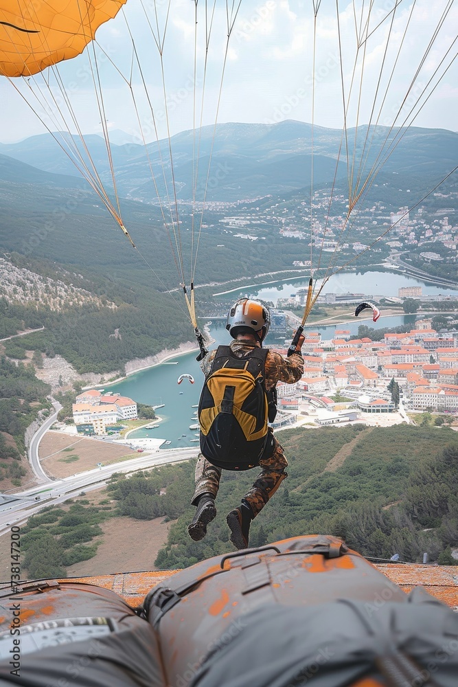 Captured mid-flight, a paraglider navigates over a winding river and lush mountains in a thrilling outdoor activity