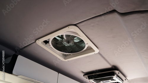 Car ceiling exhaust fan in modern camper car, car interior design concept.