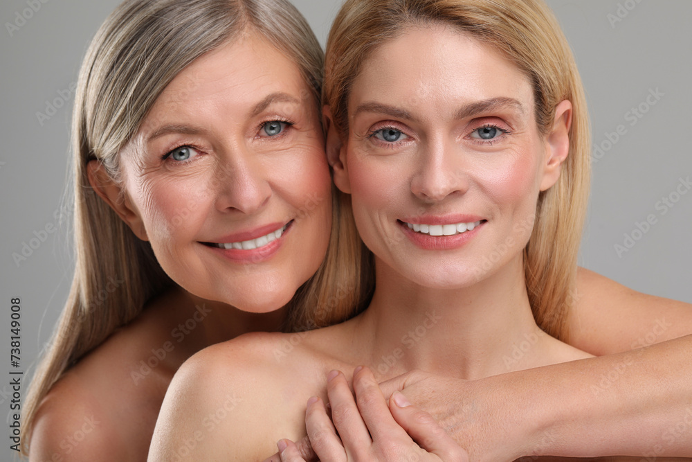 Beautiful women with healthy skin on gray background Beautiful women with healthy skin on gray background
