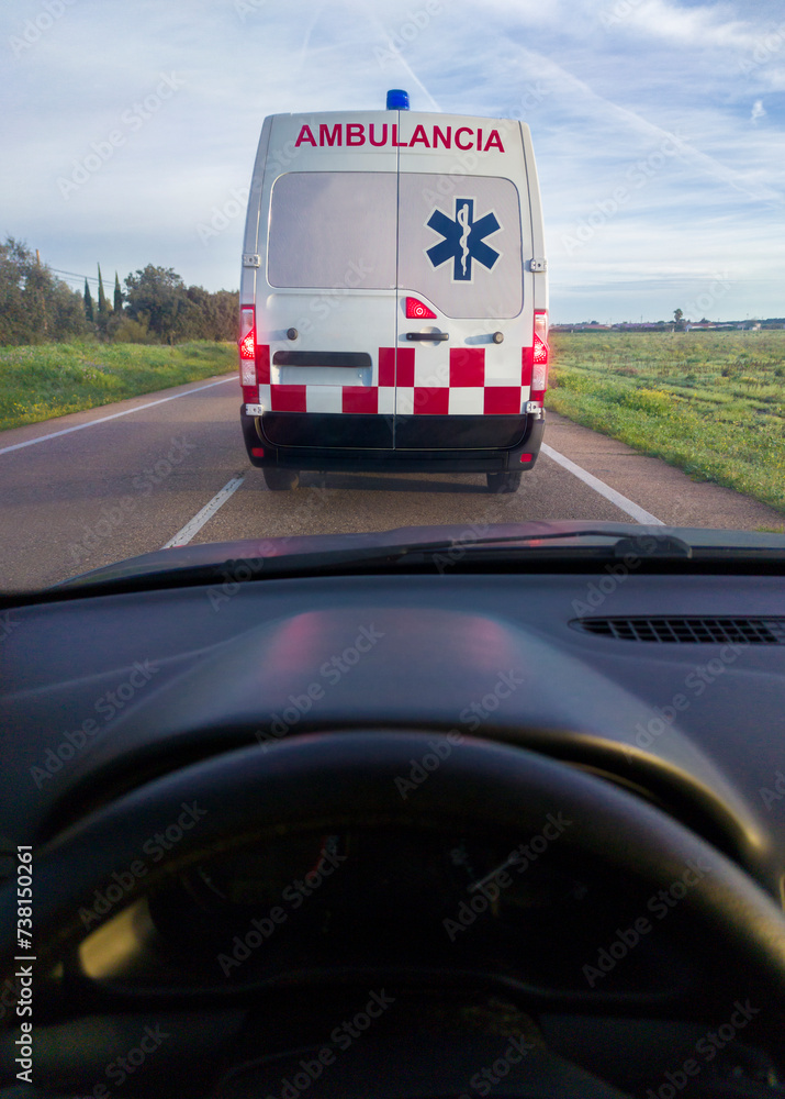 Driving behind an ambulance on local road