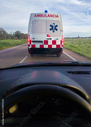 Obraz na płótnie Driving behind an ambulance on local road w salonie