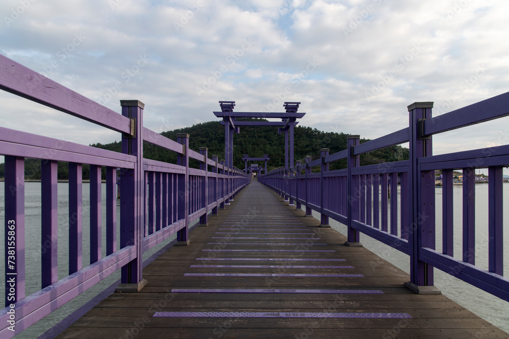 View of the bridge at the seaside during sunset View of the bridge at the seaside during sunset