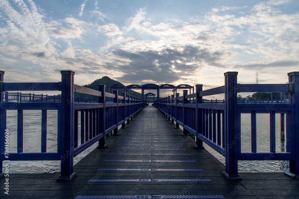 View of the bridge at the seaside during sunset