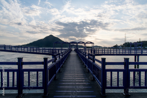 View of the bridge at the seaside during sunset