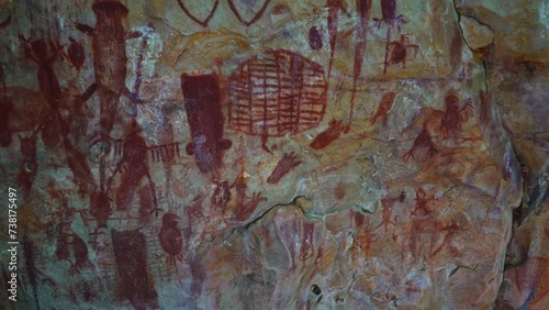 Prehistoric primitive cave art. Red painting of lizard on wall in Brazil