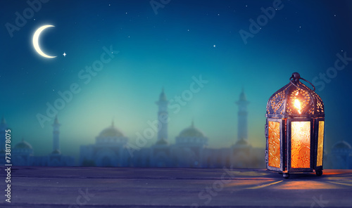 Ramadan lantern shines at night. Islamic greeting Eid Mubarak cards for Muslim Holidays..Arabic. Crescent moon and stars.