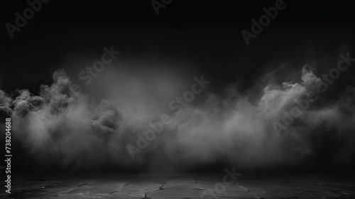 Abstract image of dark room concrete floor. Black room or stage background for product placement.Panoramic view of the abstract fog. White cloudiness, mist or smog moves on black background. photo