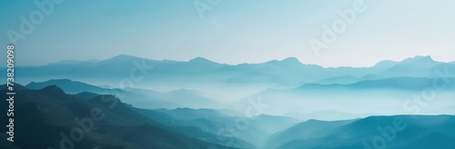 Hills and mountains in fog. Horizontal landscape photography. Panoramic aerial view. Image for banner, blog, advertisement. © Dennis