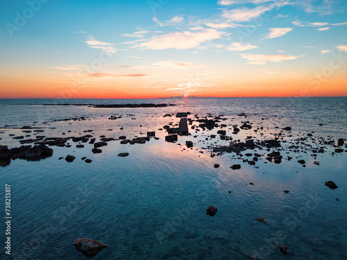 tramonto sul mare con la bassa marea,  Salento, Torre Ovo, Torricella, Taranto, Puglia, Italy photo