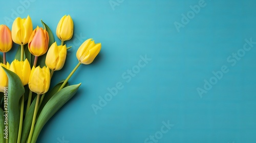 Colorful tulip flowers in front of blue background. With copy space. Top view flat lay #738214091