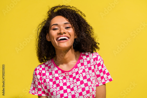 Photo of carefree positive nice person beaming smile good mood laugh empty space isolated on yellow color background © deagreez