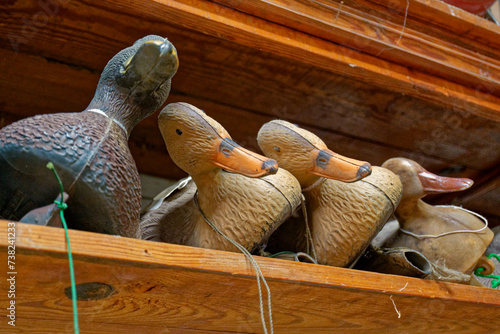 Duck decoys on a shelf photo