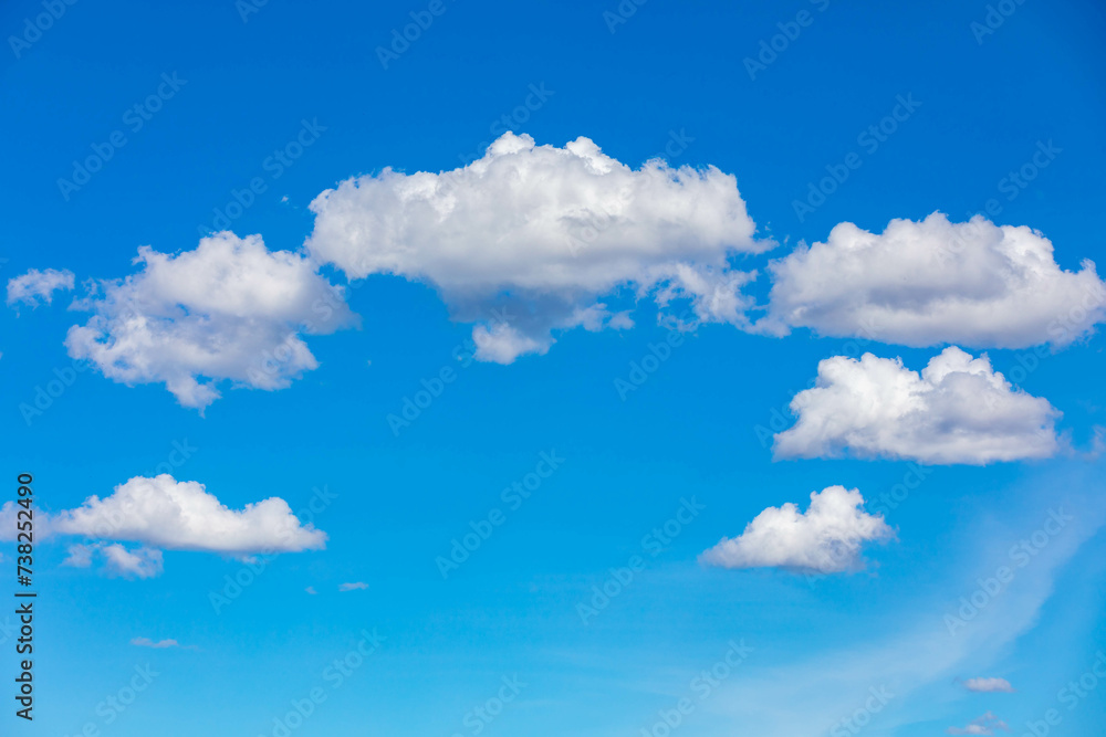 Typical blue sky with scattered white clouds Typical blue sky with scattered white clouds