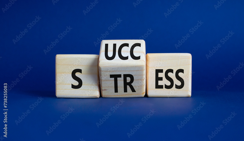 Success vs Stress symbol. Wooden cubes with words Stress and Success. Beautiful deep blue background. Business concept and Success vs Stress. Copy space Success vs Stress symbol. Wooden cubes with words Stress and Success. Beautiful deep blue background. Business concept and Success vs Stress. Copy space