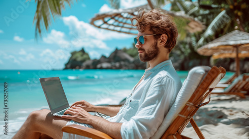 A man working on a laptop while sitting on a beach chair  with the ocean in the background.  Ai generative