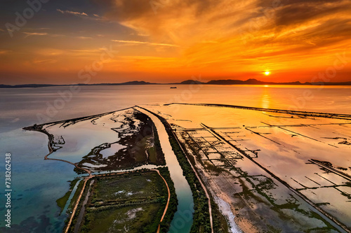 Sunset at the Delta of Kalamas river, Thesprotia, Epirus, Greece. In the background, Kerkyra (