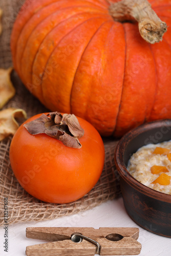 Autumn background decoration made of dried leaves and pumpkins on a white concrete, slate background. Flat layout, top view of autumn, the concept of autumn, Thanksgiving.