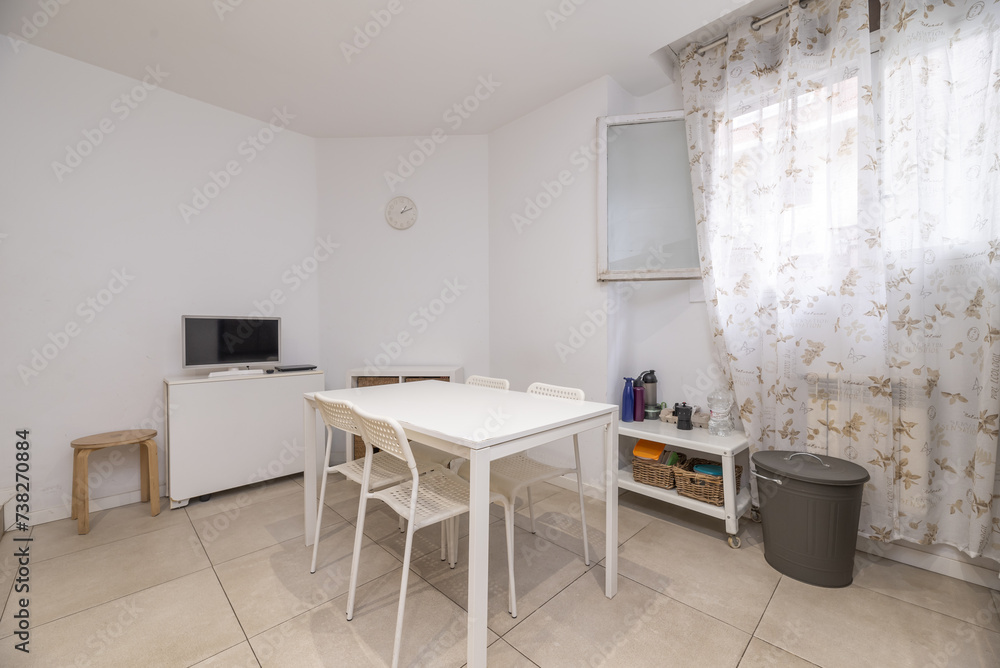 office with white wooden table and plastic chairs of the same color and window with patterned curtains office with white wooden table and plastic chairs of the same color and window with patterned curtains