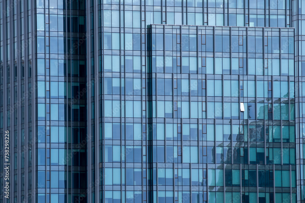 Fragment of glass facade of skyscraper. Perfect for illustrating modern architecture, urban landscapes, and corporate environments Fragment of glass facade of skyscraper. Perfect for illustrating modern architecture, urban landscapes, and corporate environments