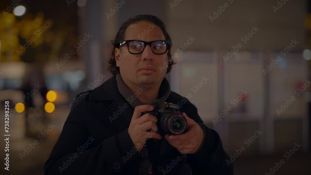 Male Traveler Taking Photo on Crowded Urban City Street at Night Male Traveler Taking Photo on Crowded Urban City Street at Night
