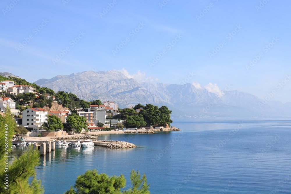 Beautiful seascape with mountains under blue sky outdoors