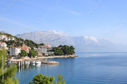 Beautiful seascape with mountains under blue sky outdoors