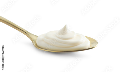 Golden spoon with mayonnaise isolated on white