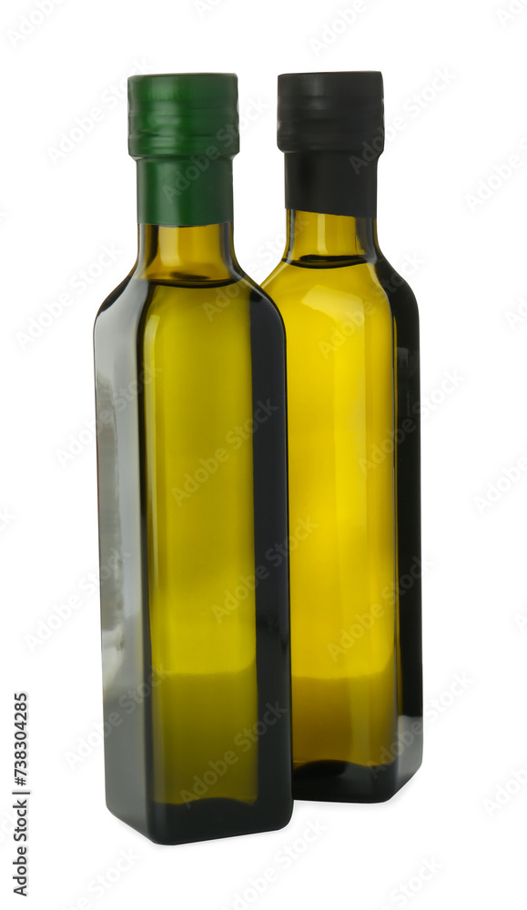 Vegetable fats. Cooking oils in glass bottles isolated on white Vegetable fats. Cooking oils in glass bottles isolated on white