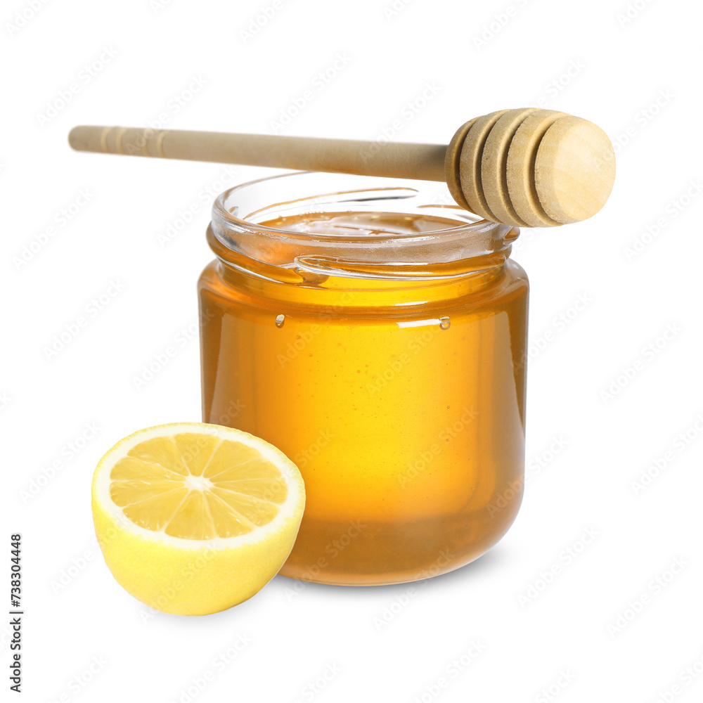 Honey in glass jar, dipper and lemon isolated on white Honey in glass jar, dipper and lemon isolated on white