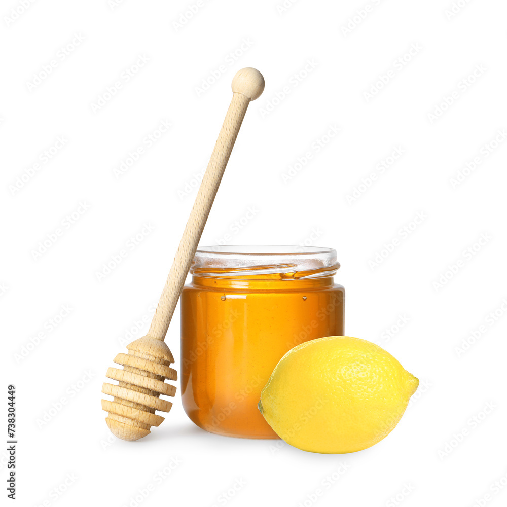 Honey in glass jar, dipper and lemon isolated on white Honey in glass jar, dipper and lemon isolated on white