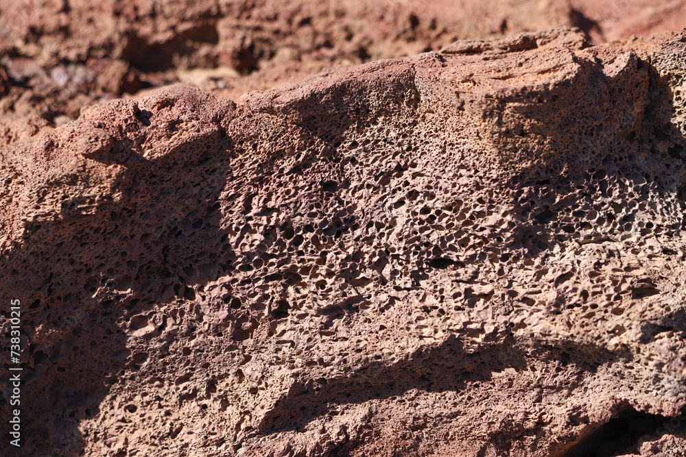 Red volcanic rock texture close up