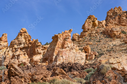 Piedras Amarillas rock formation in El Teide National Park on Tenerife. Orange volcanic cliffs close up.