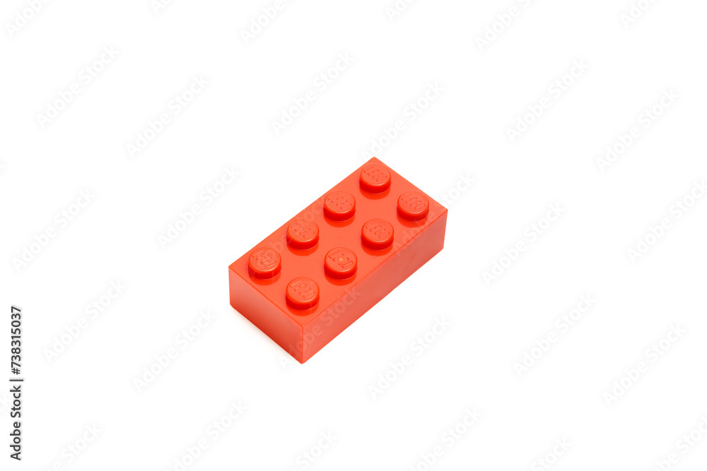 Obraz premium Single red lego plastic brick isolated on white background
