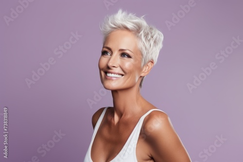 Portrait of a beautiful blond woman on a purple background. Beauty, fashion.