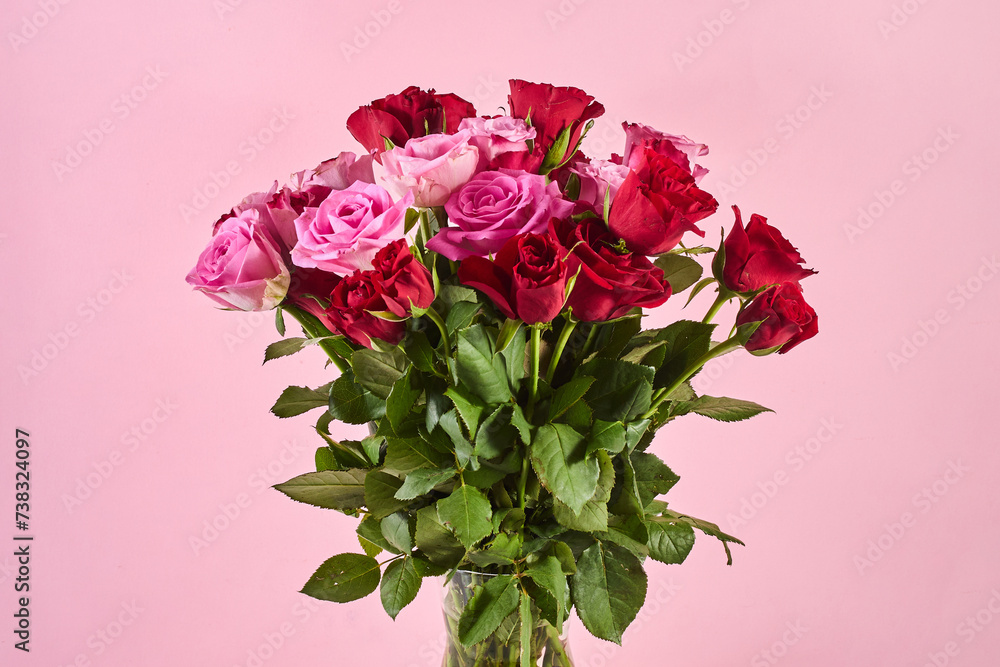 Bouquet of roses on pink background. Valentines day, 8 march or mother day floral gift.