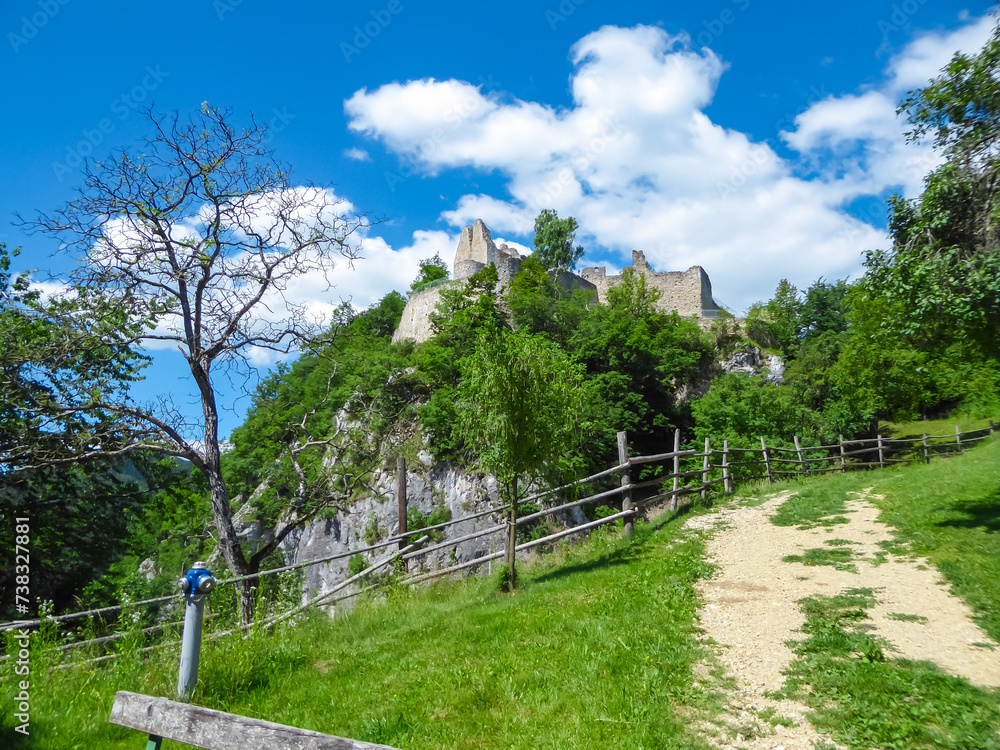 Wooden fence with panoramic view of rock castle Rabenstein in Sankt Paul im Lavanttal, Wolfsberg, Carinthia, Austria. Sightseeing of ancient ruins of landmark in Austrian Alps. Fortress built on rock Wooden fence with panoramic view of rock castle Rabenstein in Sankt Paul im Lavanttal, Wolfsberg, Carinthia, Austria. Sightseeing of ancient ruins of landmark in Austrian Alps. Fortress built on rock
