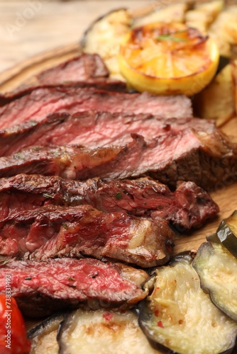 Delicious grilled beef with vegetables on table, closeup