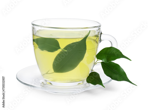 Fresh green tea in glass cup, leaves and saucer isolated on white