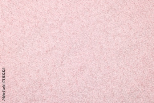 Texture of soft pink fabric as background, top view