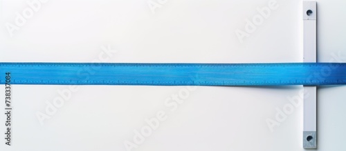 measure tape between white and blue backgrounds photo