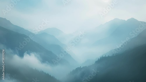The mountains appear veiled and mysterious as if hiding secrets within the depths of the mist.