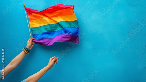 holding the flag of the lgbt community